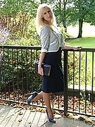 Blonde Milf teasing outdoors in a lovely pair of blue high heels and nylons