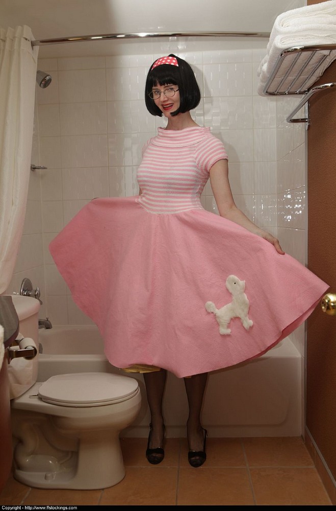Mature slut in poodle skirt and stockings in the bathroom 