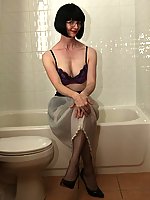 Mature slut in wet stockings, wet slip and wet heels 