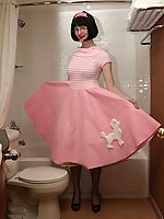 Mature slut in poodle skirt and stockings in the bathroom 